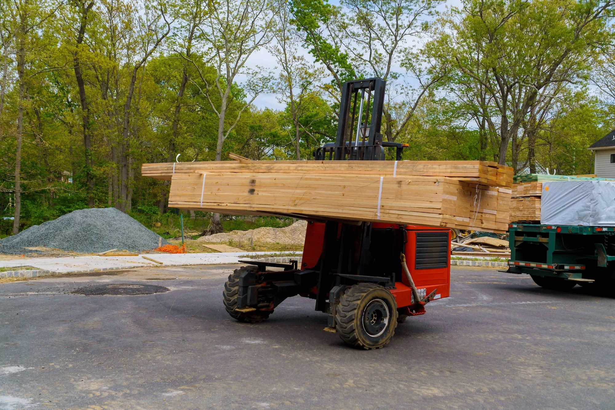 Forklift on construction preparing to construction building material parts